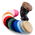 Round velvet fascinator bases in assorted colours, with a leopard-print pillbox base displayed on a mannequin