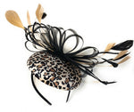 Leopard print velvet mini disc fascinator mounted on a black headband