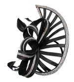Black pointed saucer fascinator with an open framework, silver diamante-trimmed loops and black feathers