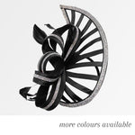 Black pointed saucer fascinator with sparkling trim, decorative loops and feathers