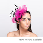 Fuchsia pink butterfly fascinator with looped netting, black feathers and beaded sprays