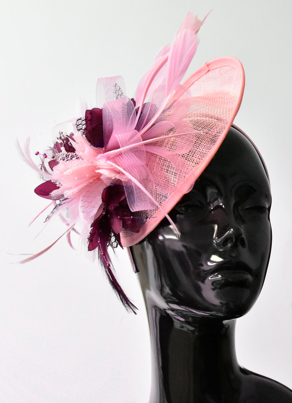 Caprilite Sinamay Fascinator Baby pink and Burgundy Saucer base hat on headband